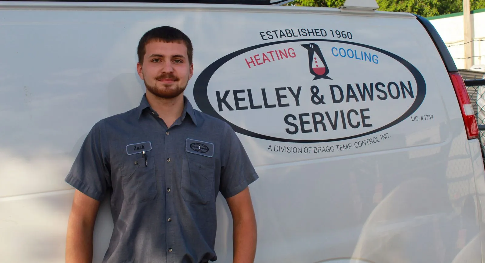 Technician Zach beside a Kelley & Dawson Service van marked Established 1960