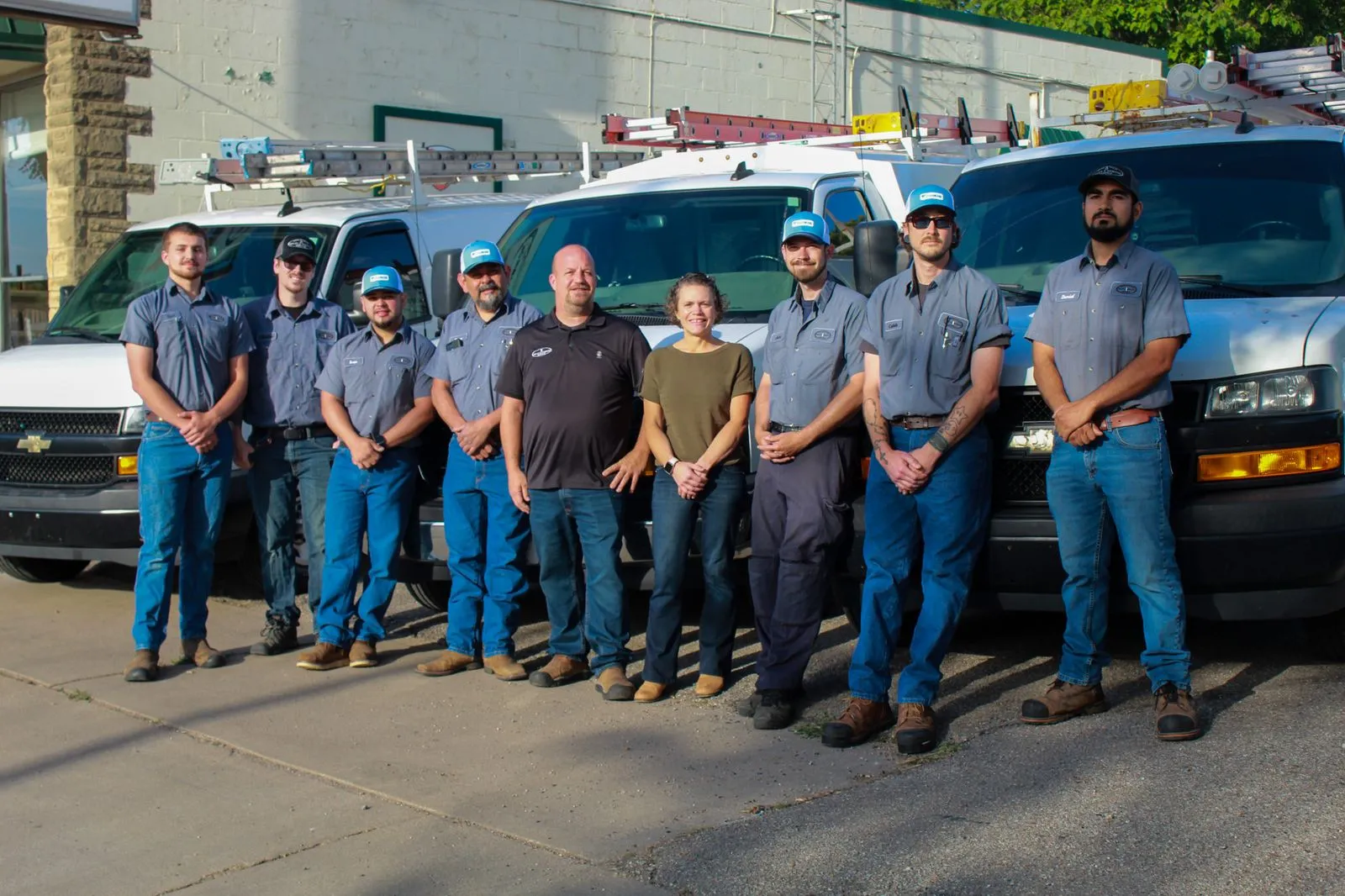 The Kelley & Dawson Service team lined up with their vans in Wichita, KS