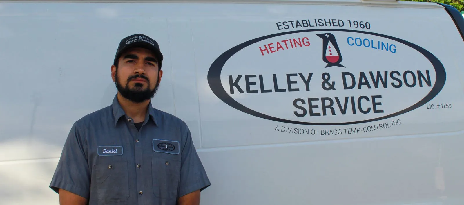 Kelley & Dawson service technician beside the company van in Wichita, KS