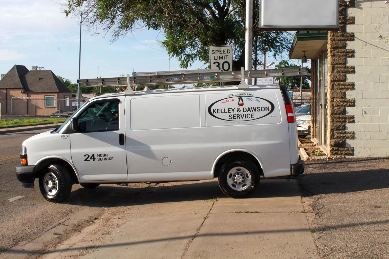 Kelley & Dawson 24-hour service van parked outside the Wichita, KS office