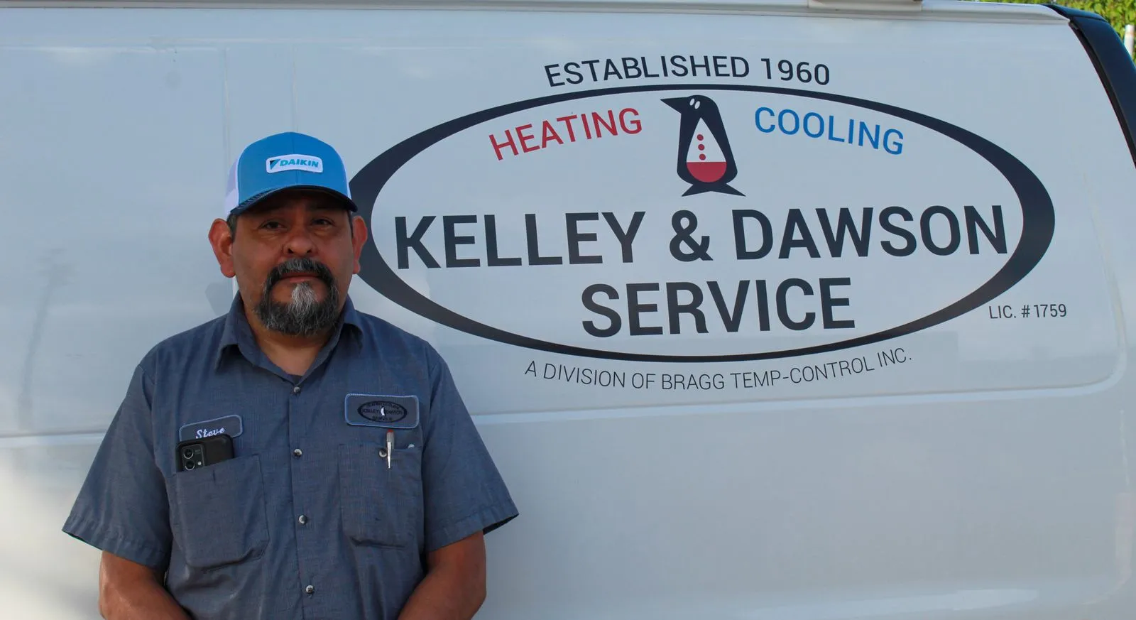 Technician Steve beside a Kelley & Dawson Service van
