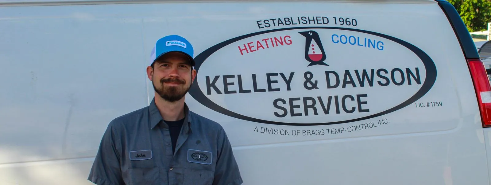 Technician John beside a Kelley & Dawson Service van